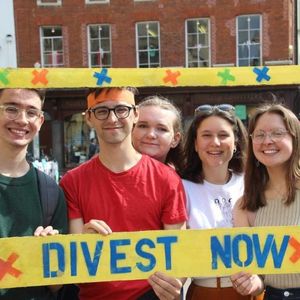 Students holding Divest frame